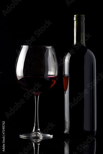 Red wine isolated on black
