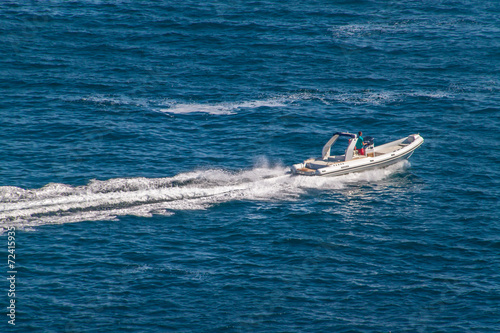 Fast boat on turquoise sea