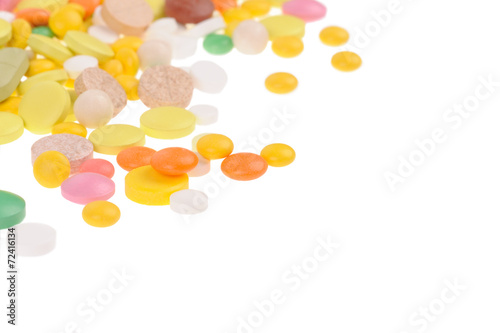 Heap of pills on white background