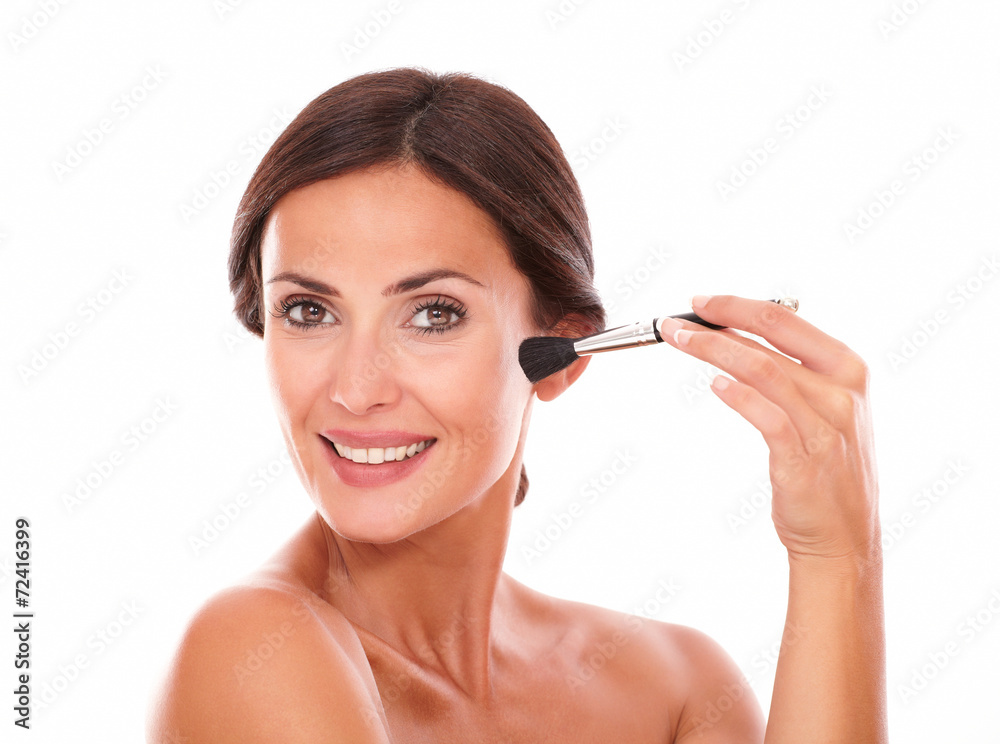 Fototapeta premium Beautiful female applying facial care product