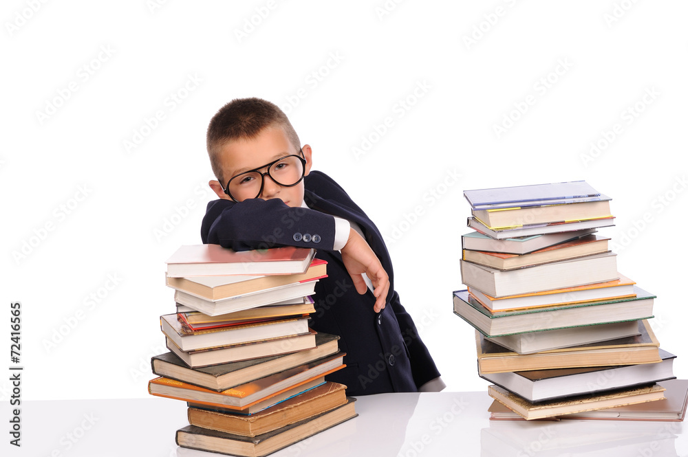 Schoolboy with huge stack of books Schoolboy with huge stack of books