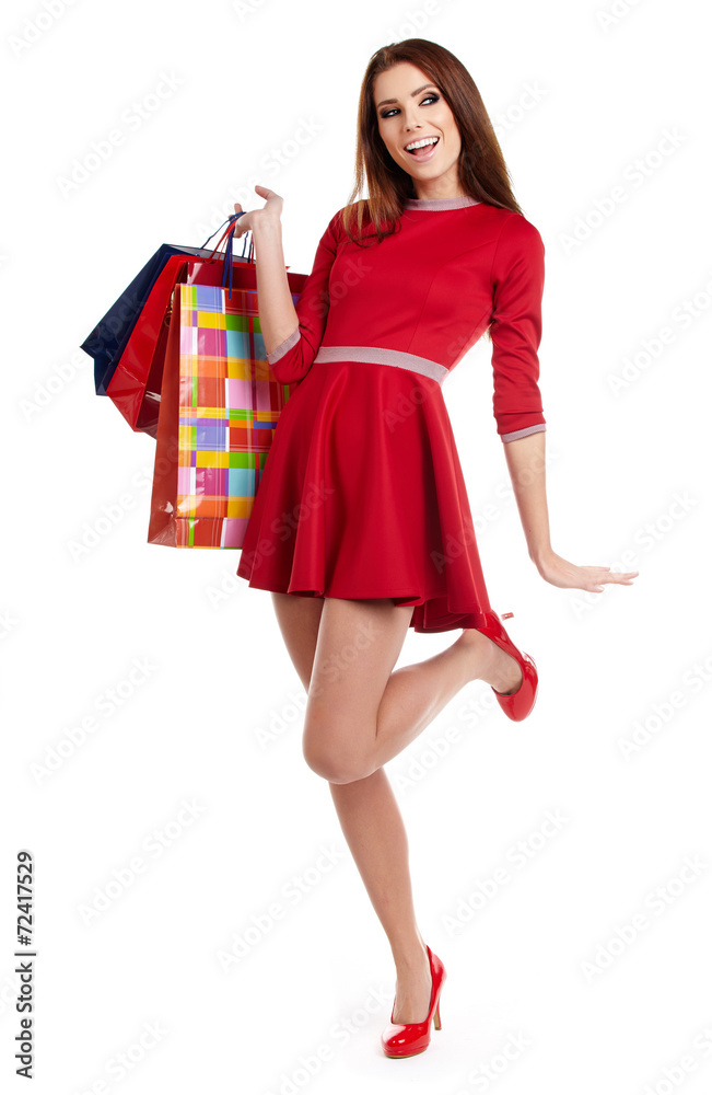Young happy smiling woman with shopping bags, isolated over whit Young happy smiling woman with shopping bags, isolated over whit