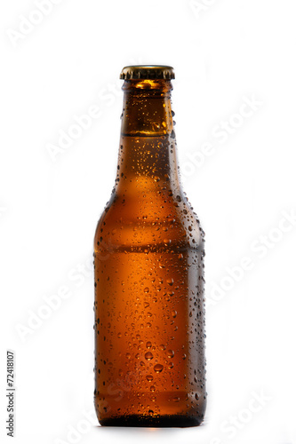 Cold bottle of beer on white background