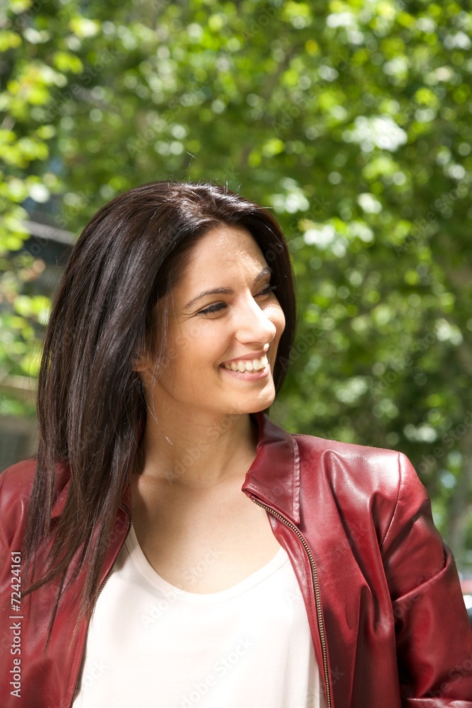 pretty brunette woman smiling at street in Madrid city Spain.