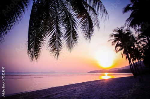 Beautiful sunset over the tropical beach © emaria