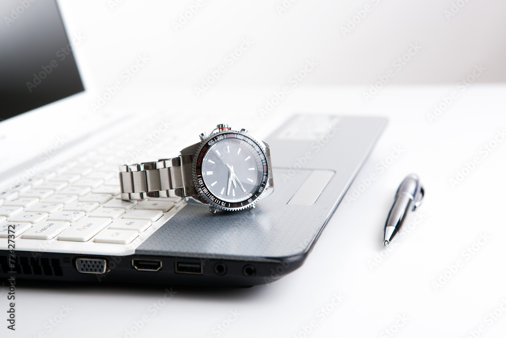 watch businessman on the laptop keyboard watch businessman on the laptop keyboard