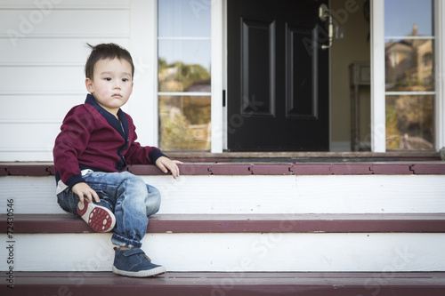 Melancholy Mixed Race Boy S...