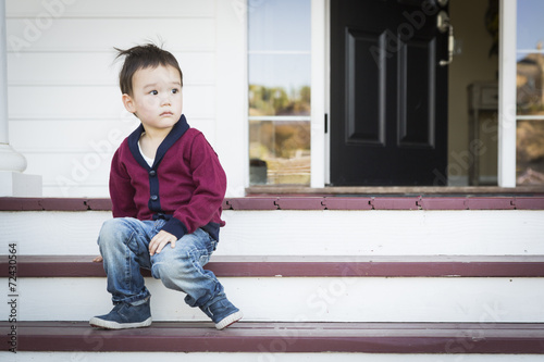 Melancholy Mixed Race Boy S...