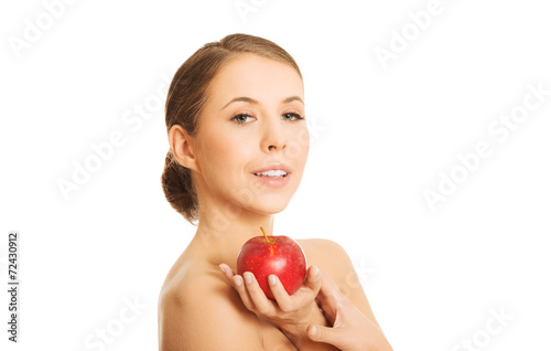 Nude woman holding an apple