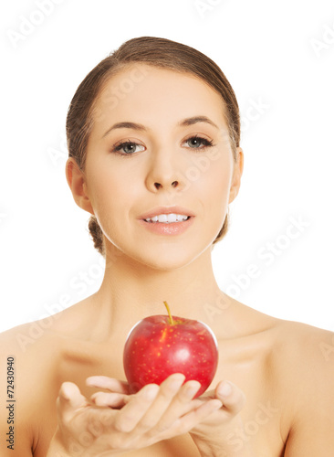 Nude woman holding an apple