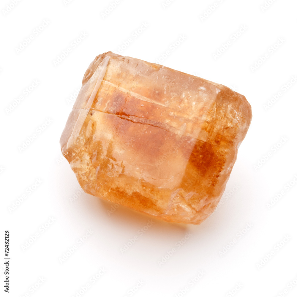 Brown caramelized lump cane sugar cube isolated on white backgro Brown caramelized lump cane sugar cube isolated on white backgro