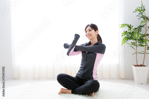 sporty asian woman exercising 