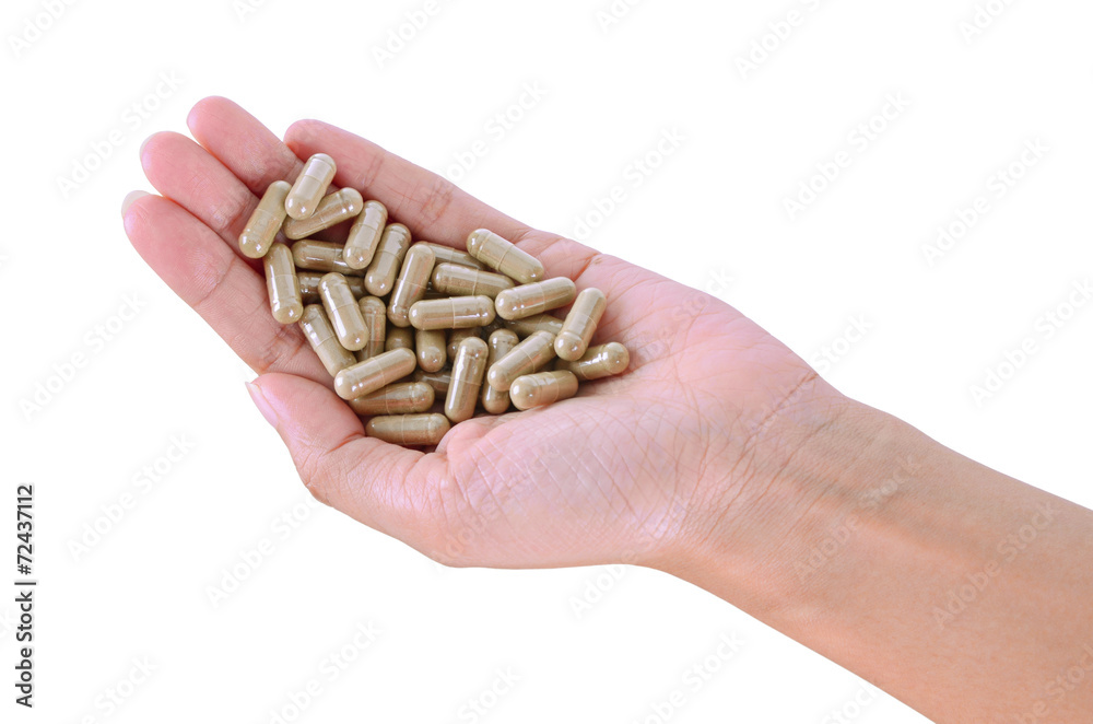 pills in hand isolated on white background pills in hand isolated on white background