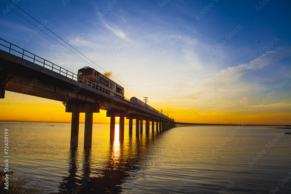 Fototapeta premium Train moving across the river