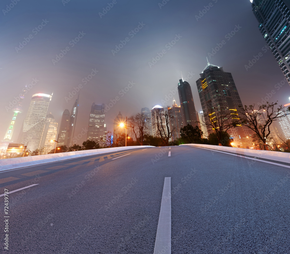 Naklejka premium Asphalt road and modern city