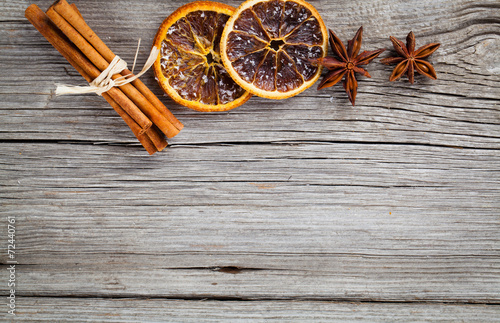 dry orange, cinnamon and Star Anise with copy space, on wooden b