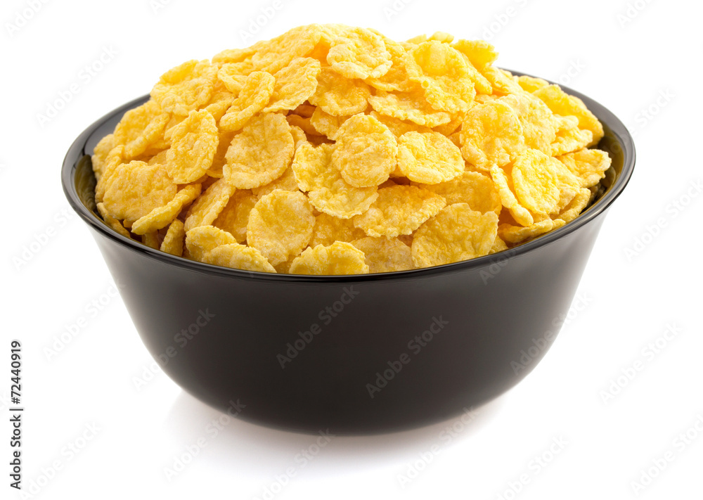 corn flakes in bowl on white corn flakes in bowl on white