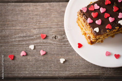 cake with hearts on wooden background