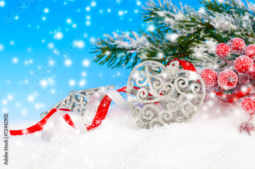Christmas decoration over snow, blue background