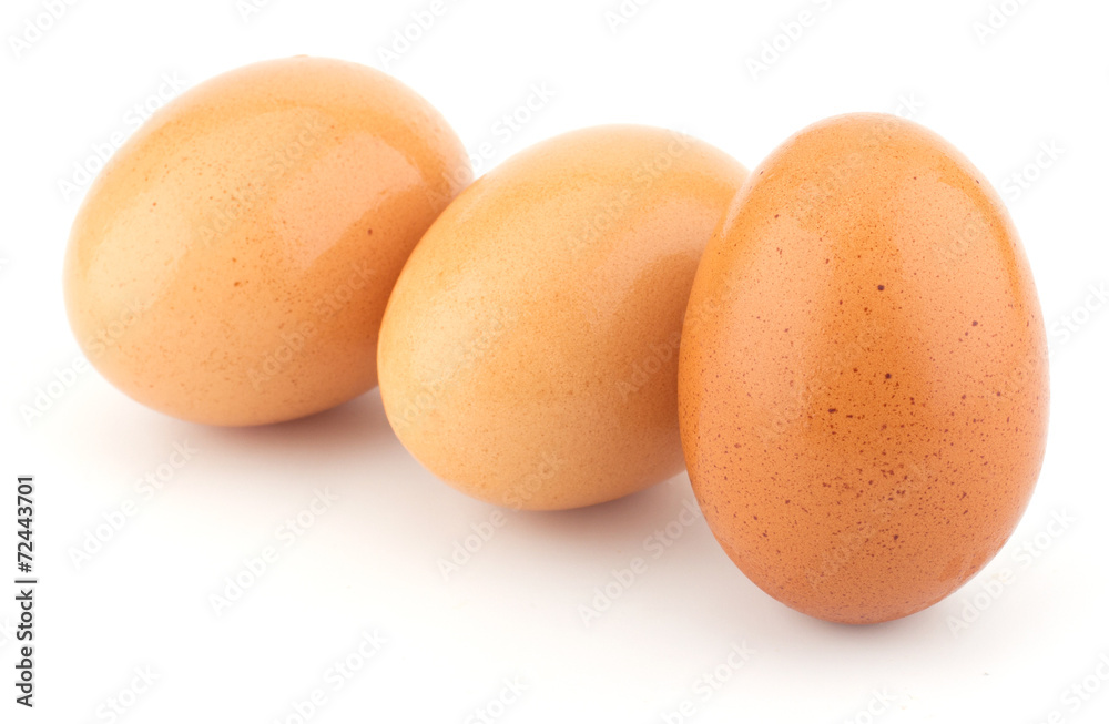 Chicken eggs closeup isolated on white background