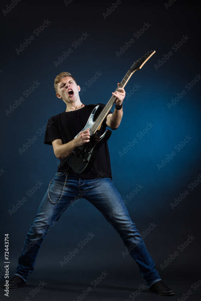 Fototapeta premium Rock musician is playing electrical guitar.