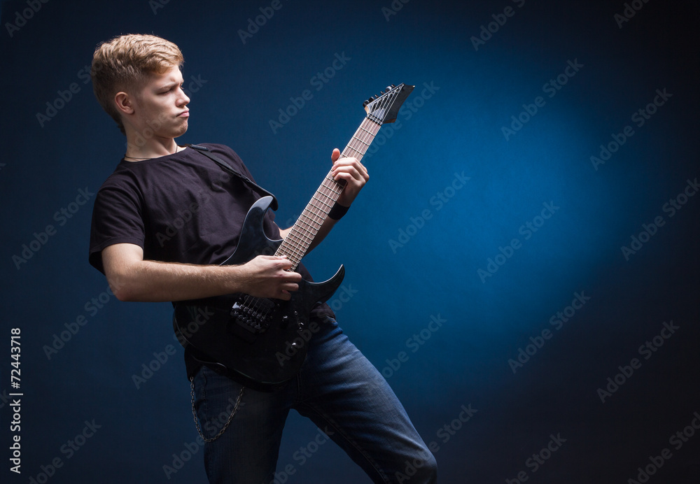 Fototapeta premium Rock musician is playing electrical guitar.