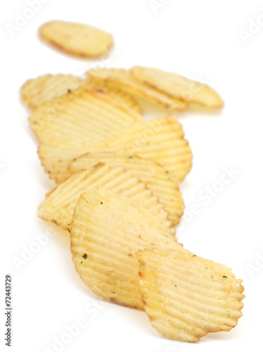 Spicy potato chips isolated on white background