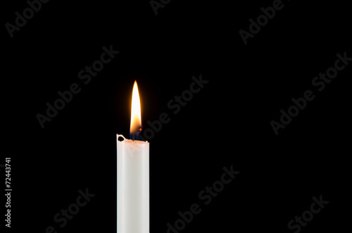 A white burning candle