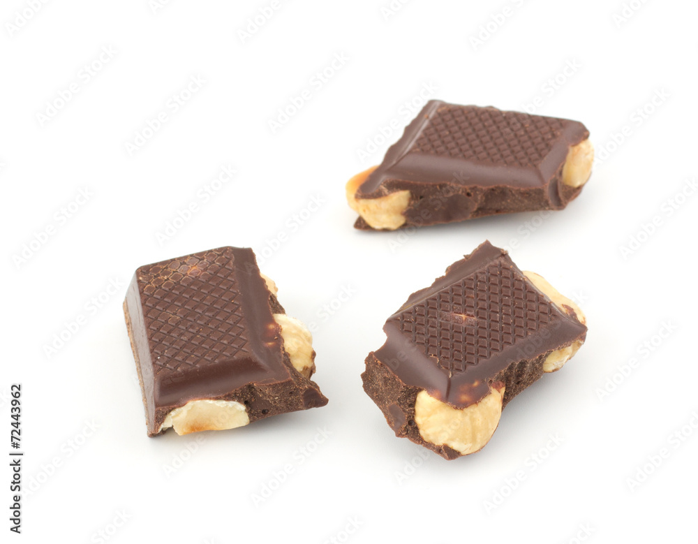 Stack of chocolate pieces with nut isolated on white background Stack of chocolate pieces with nut isolated on white background