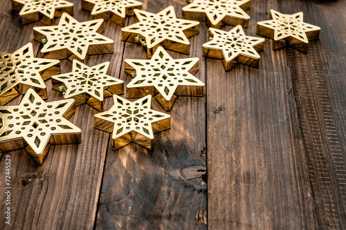 christmas decoration snowflakes and on rustic wooden background