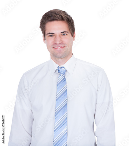 Confident Businessman Smiling Against White Background