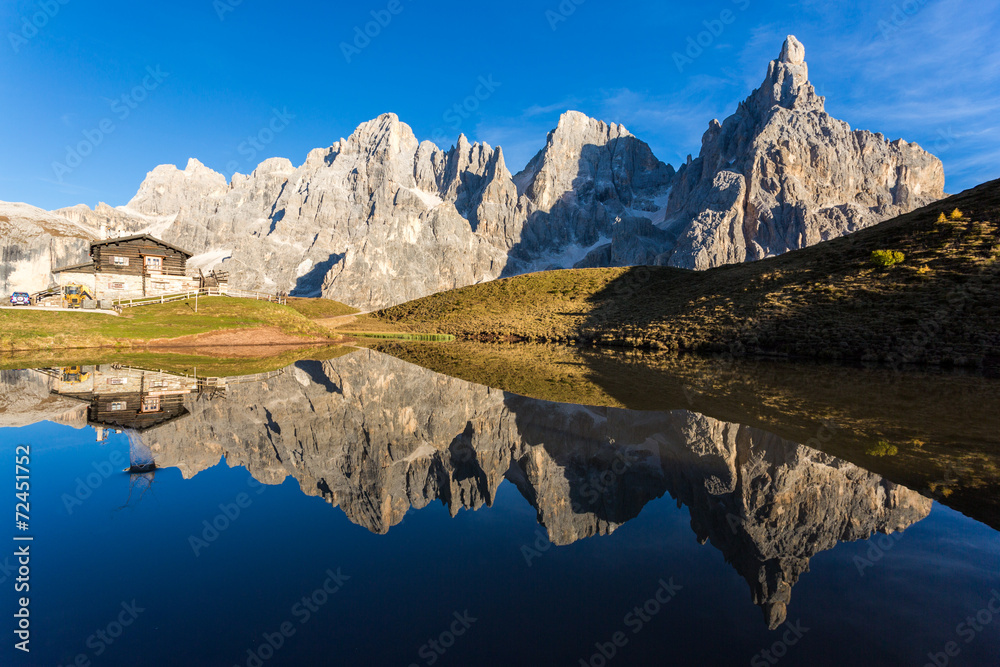 Pale di st Martino reflecting on a lake  Italian Dolomites Alps