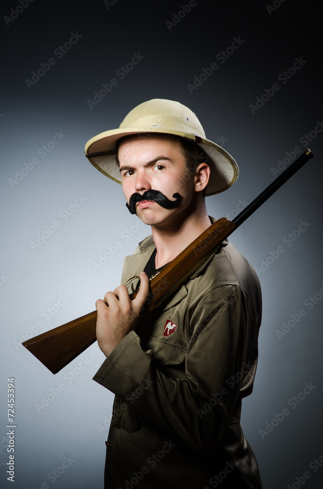 Man in safari hat in hunting concept Man in safari hat in hunting concept