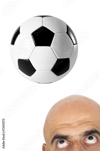 The man hitting soccer ball