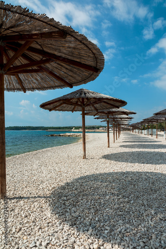 Fototapeta Naklejka Na Ścianę i Meble -  Parasols, beach Vir, Croatia