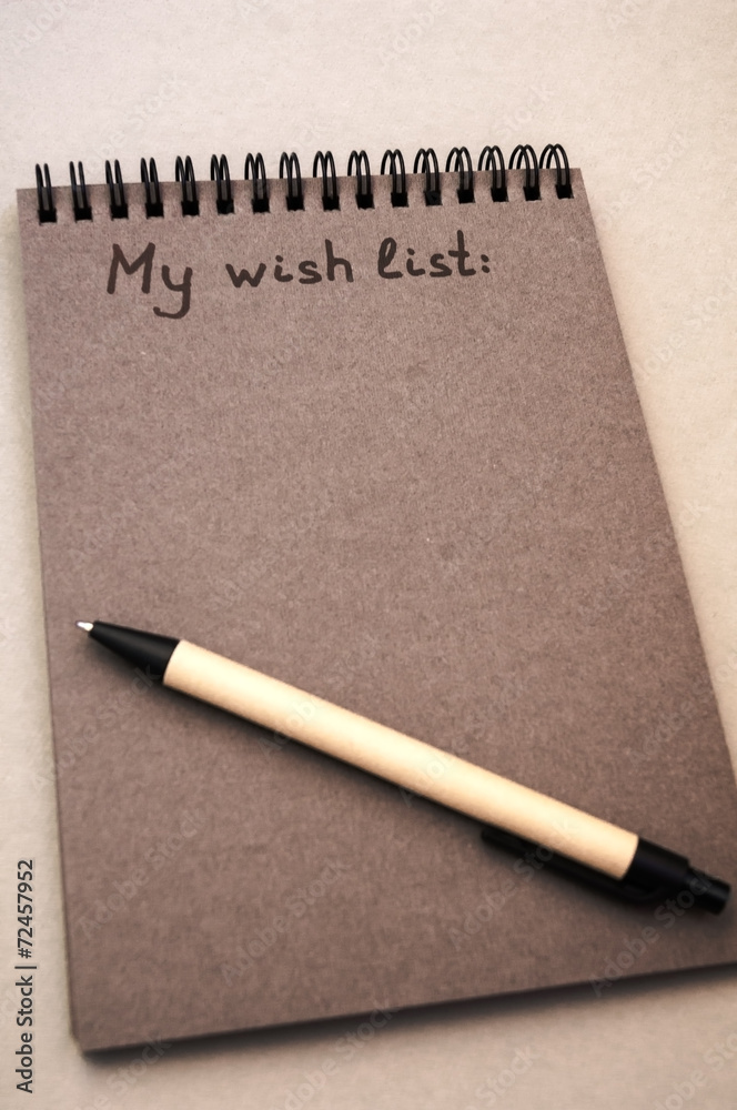 Hand drawing wish list on notebook Stock Photo | Adobe Stock