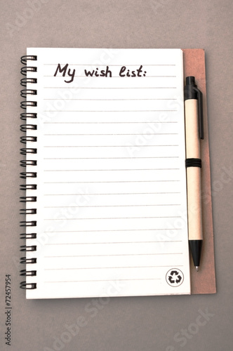 Hand drawing wish list on notebook