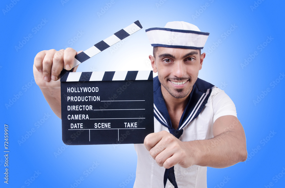 Sailor with movie clapper on white Sailor with movie clapper on white