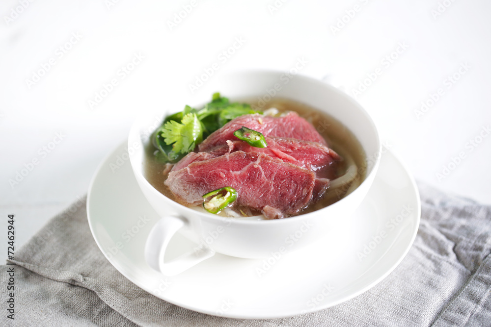 Pho beef stock soup with rice udon noodles and coriander herb