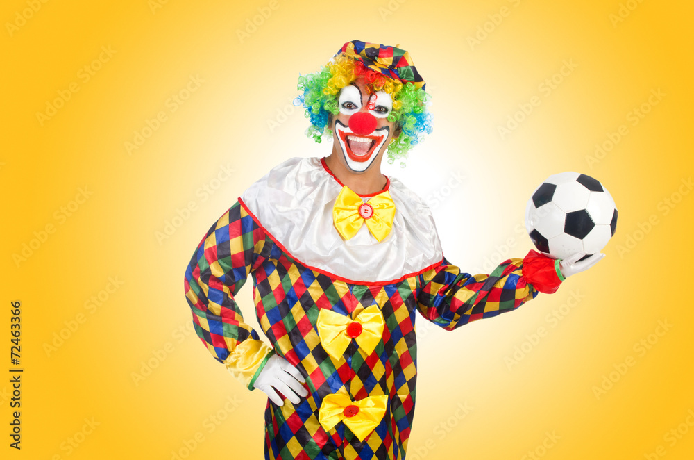 Fototapeta premium Clown with football ball on white