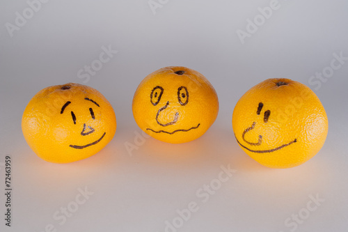 several Mandarin with painted faces with different emotions