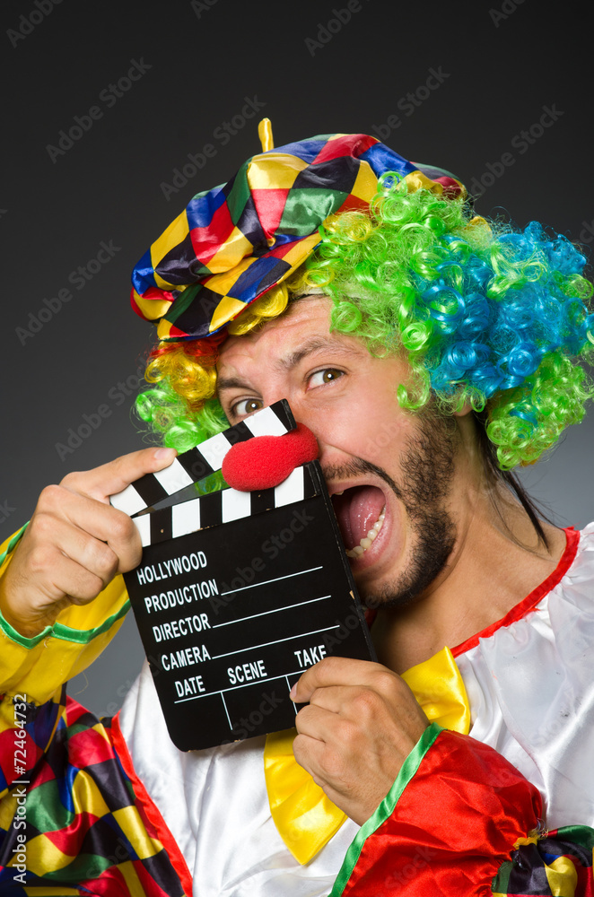 Clown with movie clapper board Clown with movie clapper board