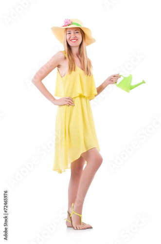Woman in yellow dress with watering can