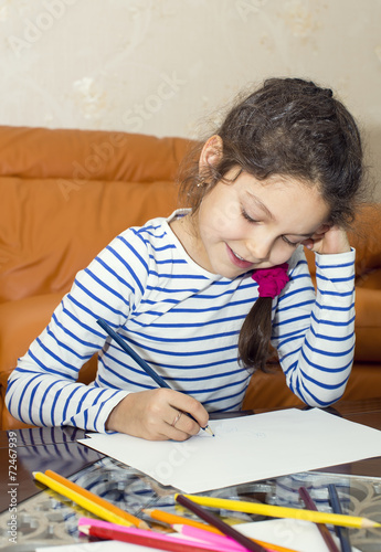 children draw with crayons on paper