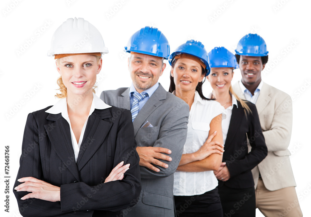 Architects Wearing Hardhats While Standing Arms Crossed Architects Wearing Hardhats While Standing Arms Crossed