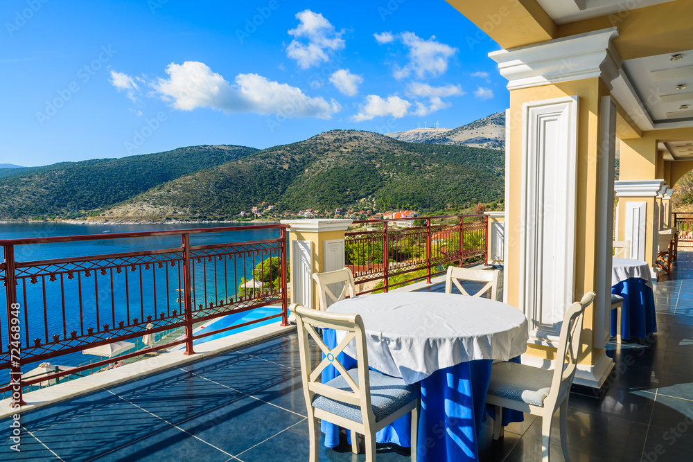 Fototapeta premium Table with chairs on terrace in Agia Efimia, Kefalonia island