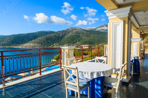 Table with chairs on terrace in Agia Efimia, Kefalonia island © pkazmierczak