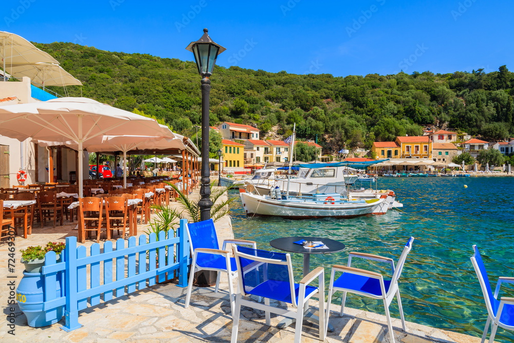Chairs and tables in restaurant in Kioni port, Ithaka island
