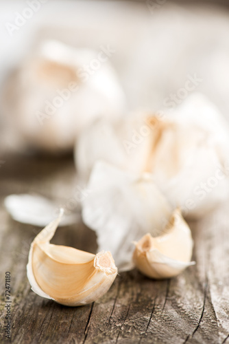 Garlic on wooden table close up copy space