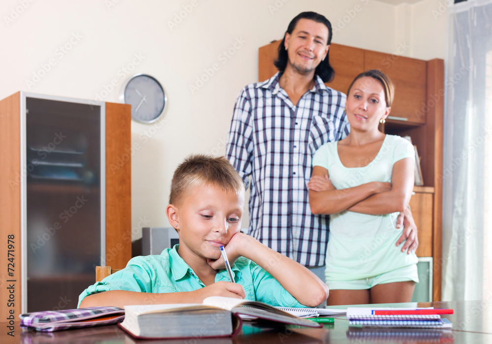 Fototapeta premium Teenager schoolboy doing homework